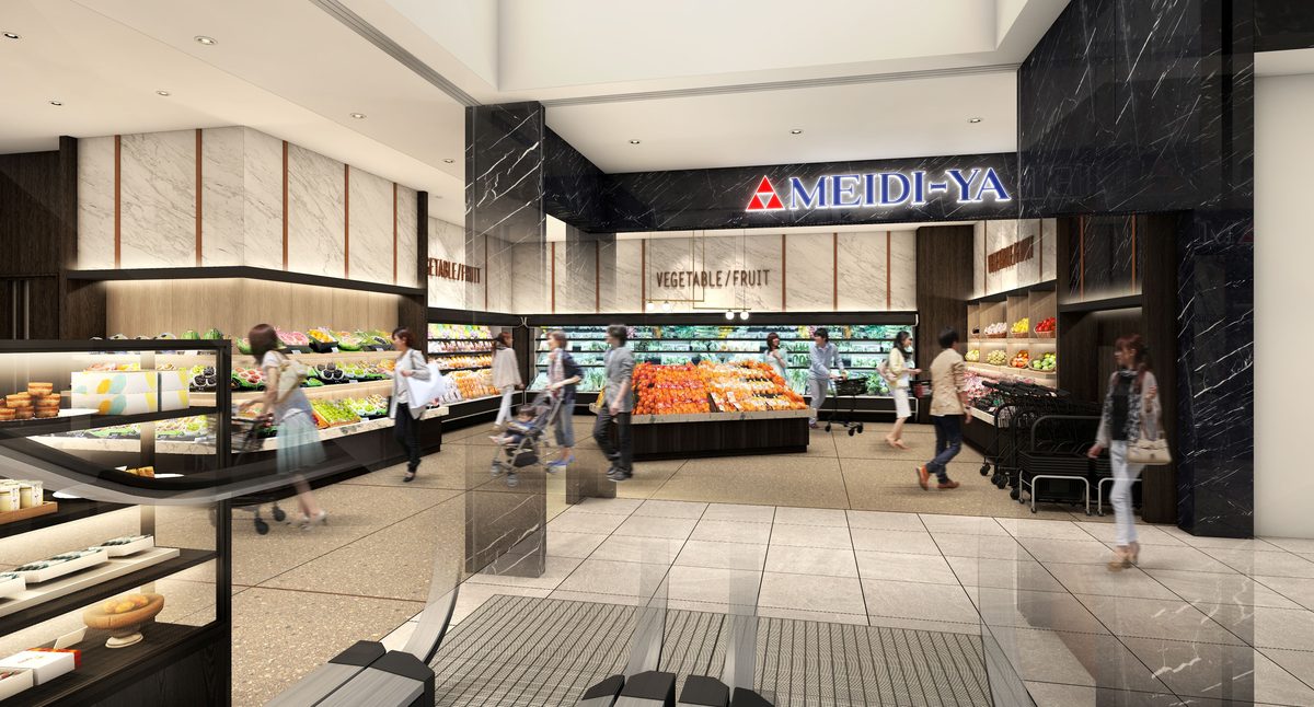 MEIDI-YA 看板が掲げられた自由が丘ストアー入口部分の店内。惣菜ケースと売場の照明が写る