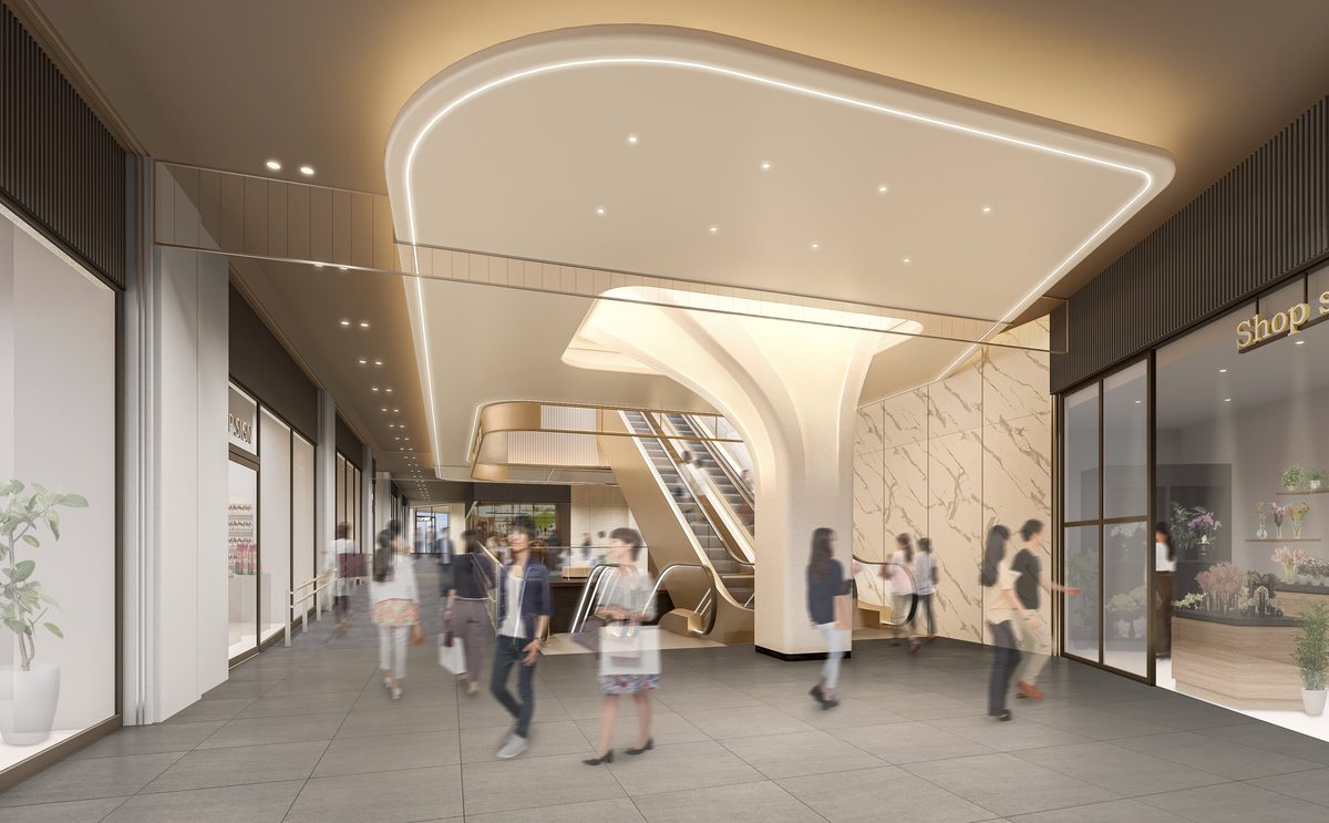 曲面の天井とエスカレーターのある吹き抜け通路を描いた商業施設の完成予想図